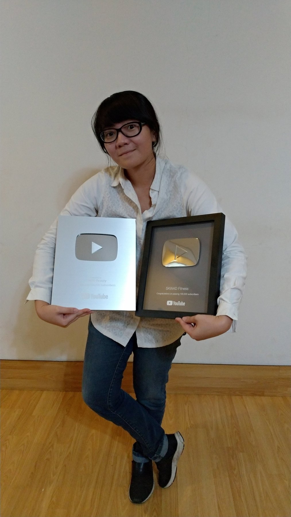 Agni holding YouTube Creator Awards, including a SKWAD Fitness award